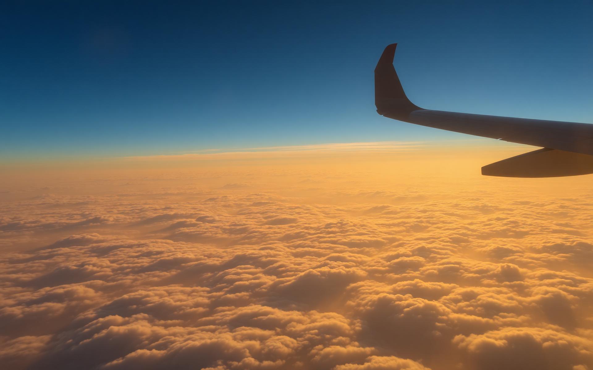 Golden clouds above the horizon at sunrise